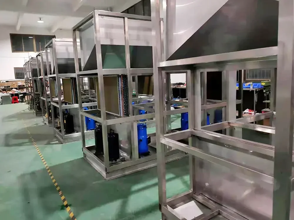 Machine frames with compressors fitted, on the production floor
